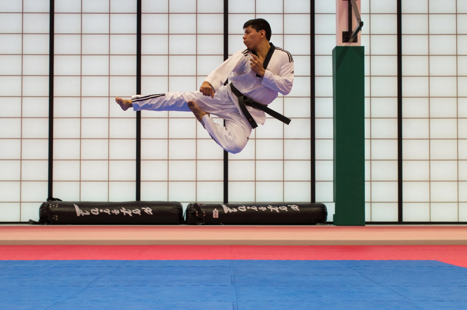 Students training in traditional Taekwondo uniforms